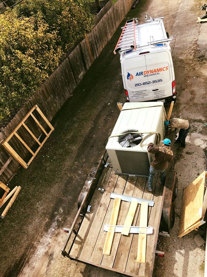 The Air Dynamics van and crew unloading a new AC unit